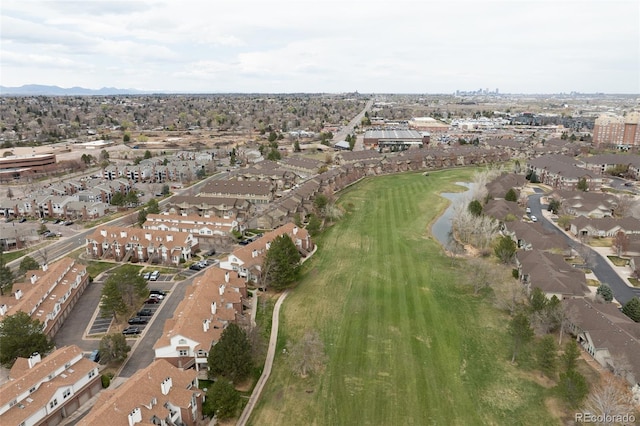 3026 W Prentice Ave Unit H, Littleton, CO 80123 - aerial view of property's location with nearby suburban area, a local golf course, and a mountainous background