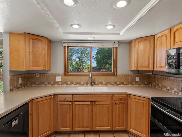 5903 S Ward St, Littleton, CO 80127 - kitchen with black appliances, a raised ceiling, light countertops, tasteful backsplash, and a textured ceiling