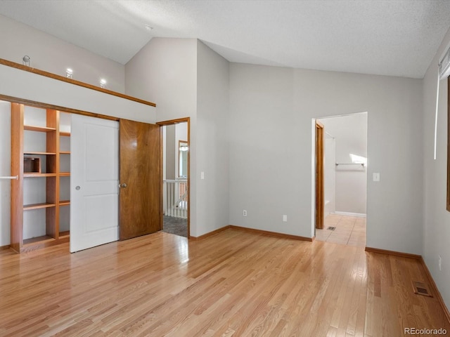 5903 S Ward St, Littleton, CO 80127 - unfurnished living room featuring light wood-style flooring and high vaulted ceiling