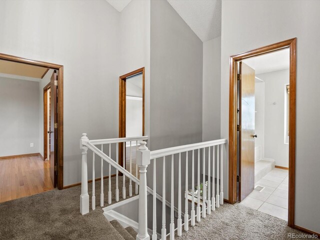 5903 S Ward St, Littleton, CO 80127 - corridor with an upstairs landing, carpet flooring, and vaulted ceiling