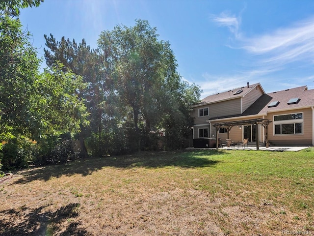 5903 S Ward St, Littleton, CO 80127 - view of grassy yard featuring a patio area