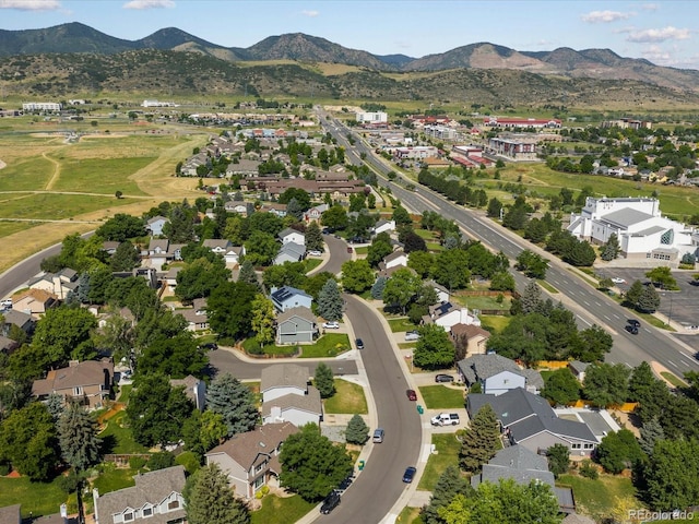 5903 S Ward St, Littleton, CO 80127 - aerial view of property and surrounding area with a mountain backdrop and nearby suburban area