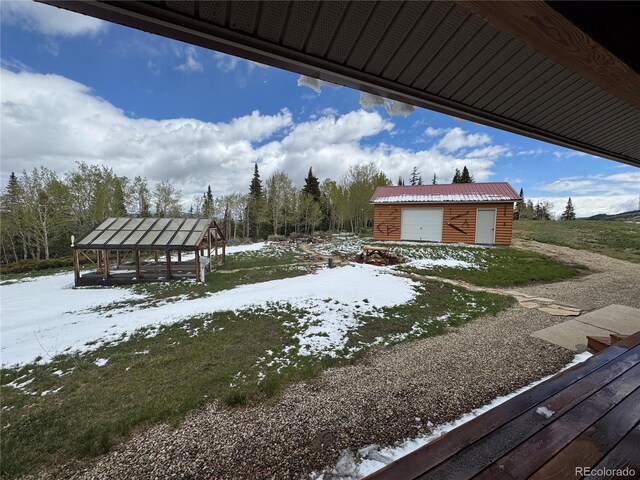 73 County Road 1931, Kremmling, CO 80459 - yard covered in snow with an outbuilding