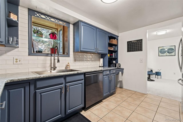 kitchen featuring light tile patterned flooring, blue cabinets, black dishwasher, sink, and backsplash