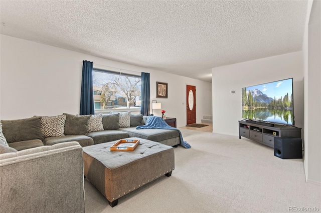 living room featuring carpet floors and a textured ceiling