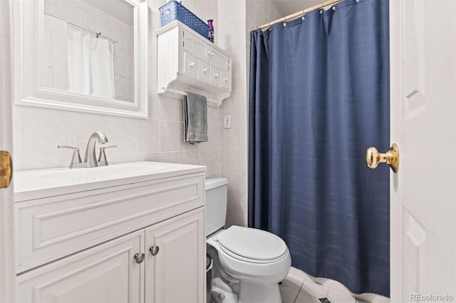 bathroom with toilet, tasteful backsplash, a shower with curtain, tile walls, and vanity