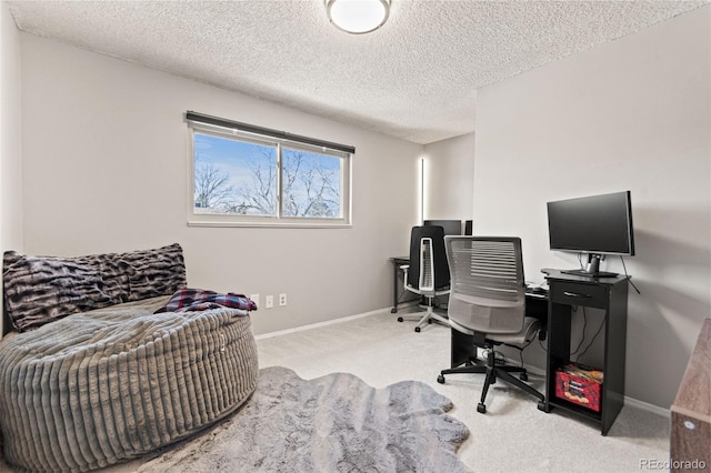 carpeted office with a textured ceiling