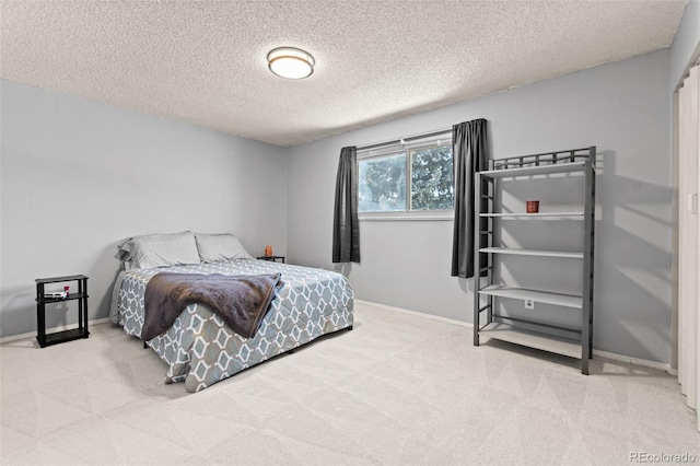 carpeted bedroom with a textured ceiling