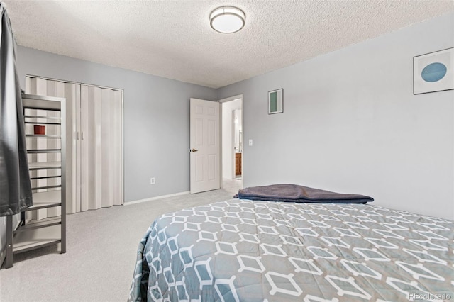 carpeted bedroom with a textured ceiling