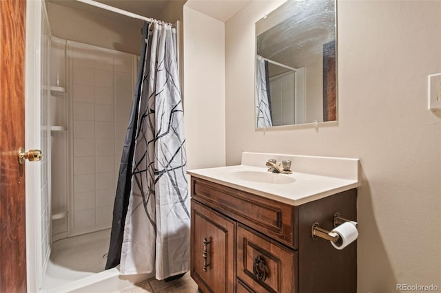 bathroom featuring vanity and a shower with shower curtain