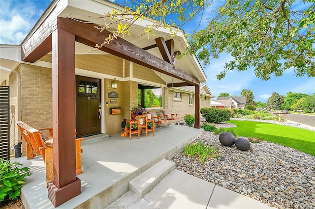 6015 S Milwaukee Way, Centennial, CO 80121 - covered porch featuring a yard