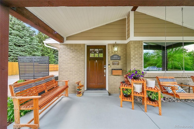 6015 S Milwaukee Way, Centennial, CO 80121 - view of exterior entry featuring brick siding and a porch