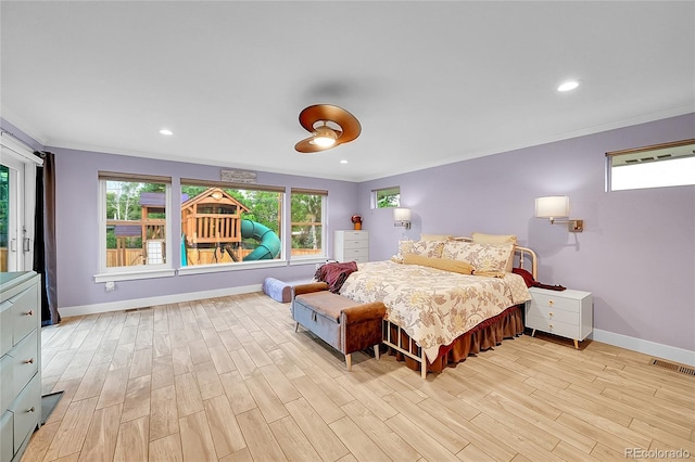 6015 S Milwaukee Way, Centennial, CO 80121 - bedroom featuring ornamental molding, light wood-style flooring, and recessed lighting
