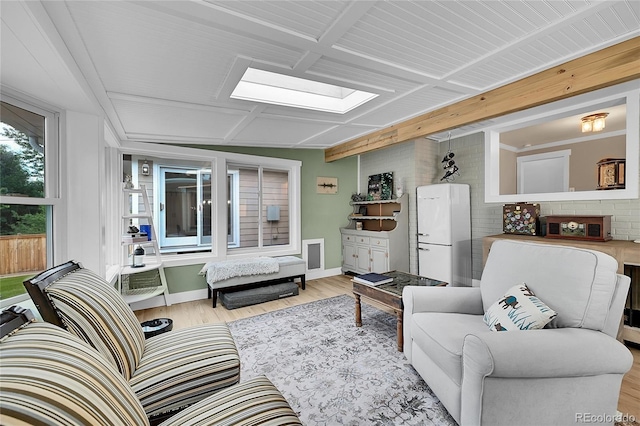 6015 S Milwaukee Way, Centennial, CO 80121 - living area featuring a skylight and wood finished floors