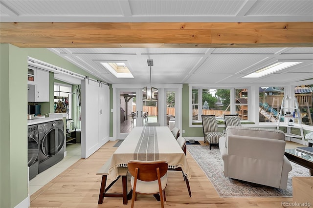 6015 S Milwaukee Way, Centennial, CO 80121 - sunroom / solarium with washing machine and dryer, a barn door, and french doors