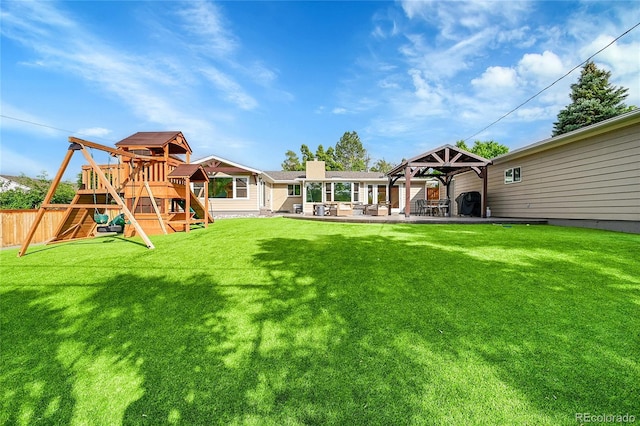6015 S Milwaukee Way, Centennial, CO 80121 - rear view of property with a playground, a gazebo, a patio, and a chimney