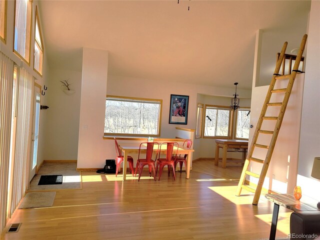 dining room with visible vents, baseboards, and wood finished floors