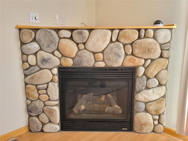1210 Kiowa St, Como, CO 80432 - detailed view of a fireplace and wood finished floors