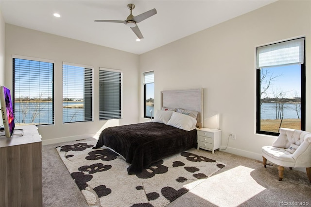 bedroom with recessed lighting, light colored carpet, a ceiling fan, and baseboards