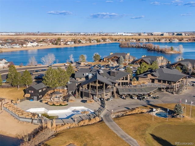 drone / aerial view featuring a residential view and a water view