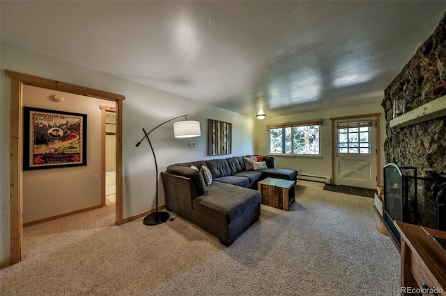 446 Hi Country Drive 17 & 18, Winter Park, CO 80482 - living area with a baseboard heating unit, carpet, a stone fireplace, and baseboards