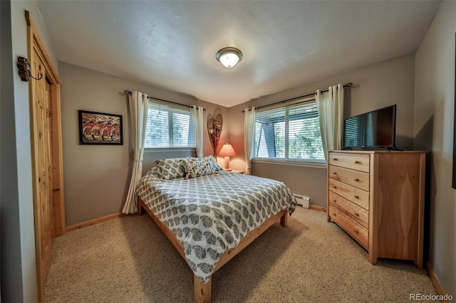 446 Hi Country Drive 17 & 18, Winter Park, CO 80482 - bedroom featuring baseboards, baseboard heating, and light carpet