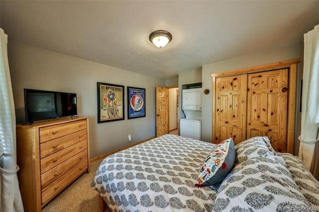446 Hi Country Drive 17 & 18, Winter Park, CO 80482 - carpeted bedroom with estacked washer and dryer, a closet, and baseboards