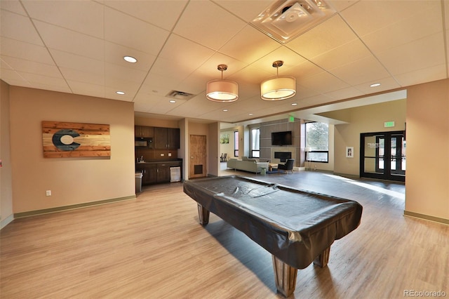 446 Hi Country Drive 17 & 18, Winter Park, CO 80482 - playroom with billiards table, baseboards, light wood finished floors, a paneled ceiling, and a fireplace