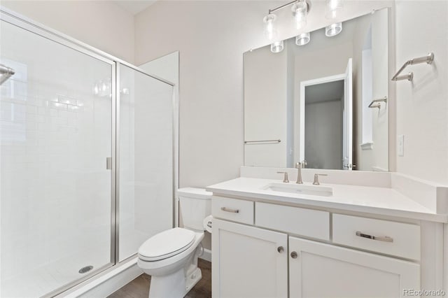 7051 S White Crow Way, Aurora, CO 80016 - bathroom with a stall shower, toilet, vanity, and wood finished floors