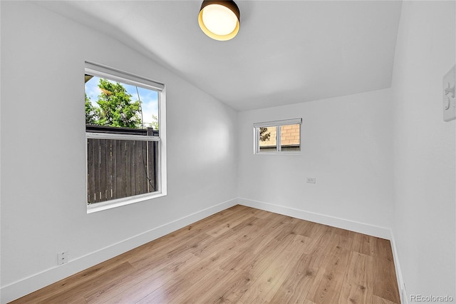 3064 S Galapago St, Englewood, CO 80110 - spare room with lofted ceiling, baseboards, and wood finished floors