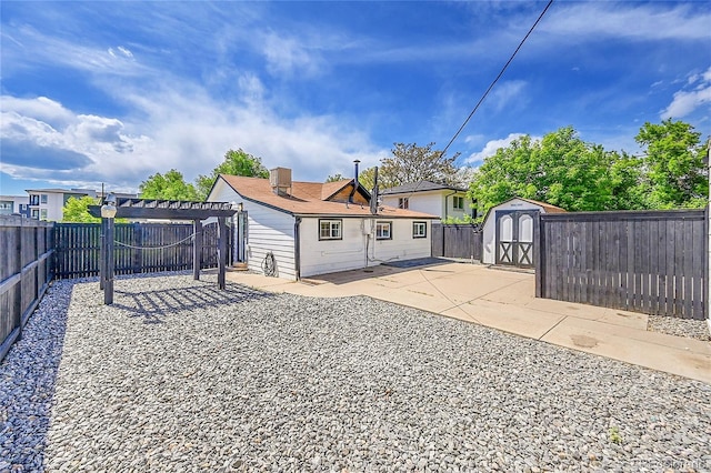 3064 S Galapago St, Englewood, CO 80110 - back of house featuring a pergola, a patio, and a fenced backyard