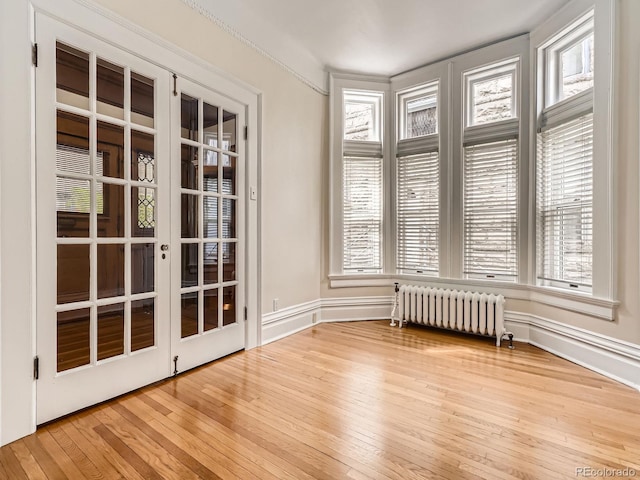 1453 Vine St, Denver, CO 80206 - unfurnished sunroom featuring radiator and french doors