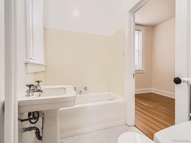 1453 Vine St, Denver, CO 80206 - full bathroom featuring toilet, baseboards, and tile patterned floors