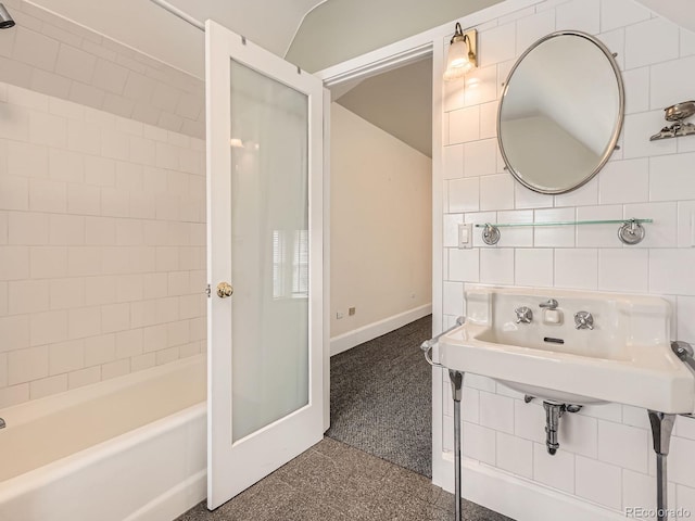 1453 Vine St, Denver, CO 80206 - full bath featuring baseboards and washtub / shower combination