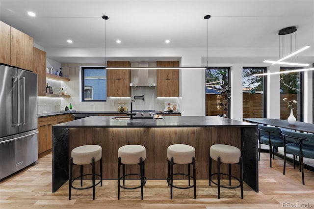2378 S Bannock St, Denver, CO 80223 - kitchen featuring high end fridge, modern cabinets, dark countertops, and recessed lighting