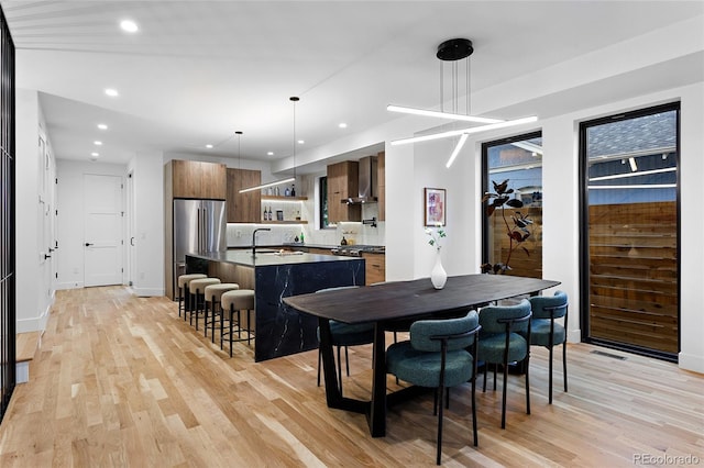 2378 S Bannock St, Denver, CO 80223 - dining area featuring light wood finished floors and recessed lighting