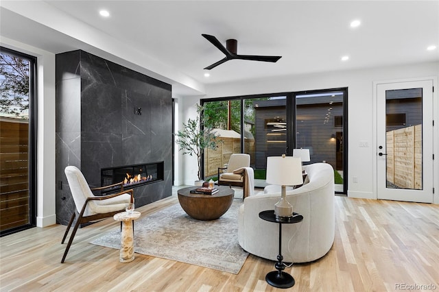 2378 S Bannock St, Denver, CO 80223 - sitting room with wood finished floors, recessed lighting, a premium fireplace, and ceiling fan