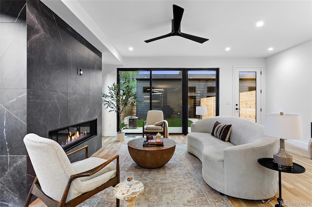 2378 S Bannock St, Denver, CO 80223 - living room featuring wood finished floors, recessed lighting, a fireplace, and ceiling fan