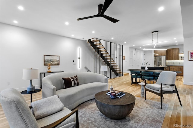 2378 S Bannock St, Denver, CO 80223 - living room with light wood finished floors, recessed lighting, a ceiling fan, and stairway