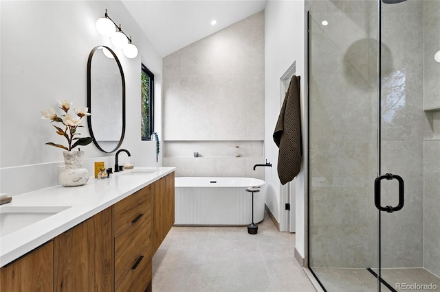2378 S Bannock St, Denver, CO 80223 - full bath featuring lofted ceiling, a freestanding bath, double vanity, and a shower stall