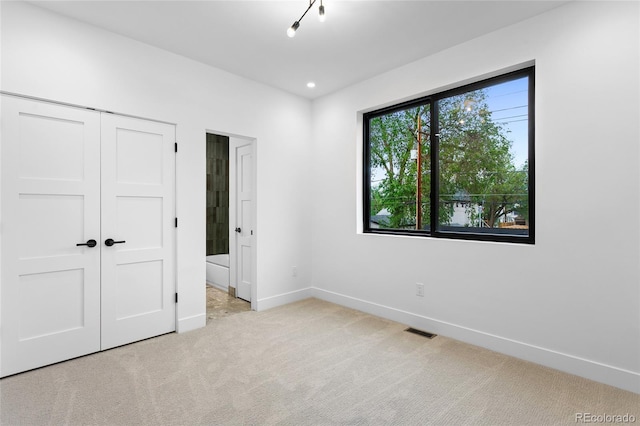 2378 S Bannock St, Denver, CO 80223 - unfurnished bedroom featuring carpet flooring, a closet, and recessed lighting