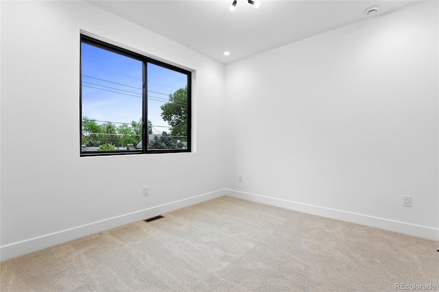 2378 S Bannock St, Denver, CO 80223 - unfurnished room with light colored carpet, a smoke detector, and recessed lighting