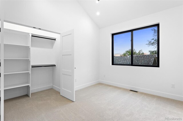 2378 S Bannock St, Denver, CO 80223 - unfurnished bedroom with carpet floors, high vaulted ceiling, a closet, and recessed lighting