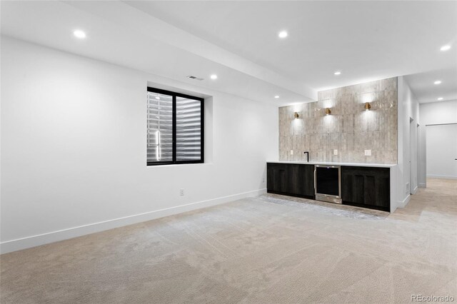 2378 S Bannock St, Denver, CO 80223 - indoor wet bar with beverage cooler, recessed lighting, light colored carpet, and decorative backsplash