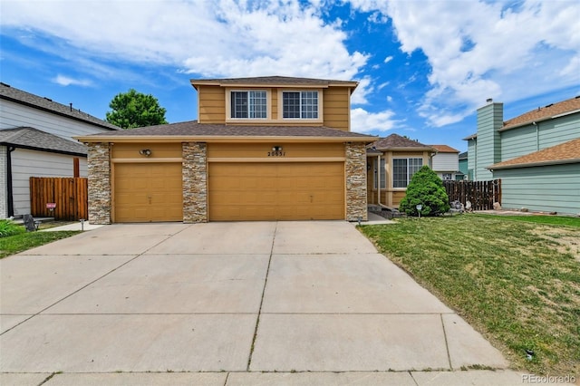 20651 E 42nd Ave, Denver, CO 80249 - view of front facade with driveway, a shingled roof, stone siding, and an attached garage