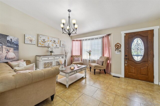 20651 E 42nd Ave, Denver, CO 80249 - living area featuring a chandelier, plenty of natural light, light tile patterned flooring, and lofted ceiling