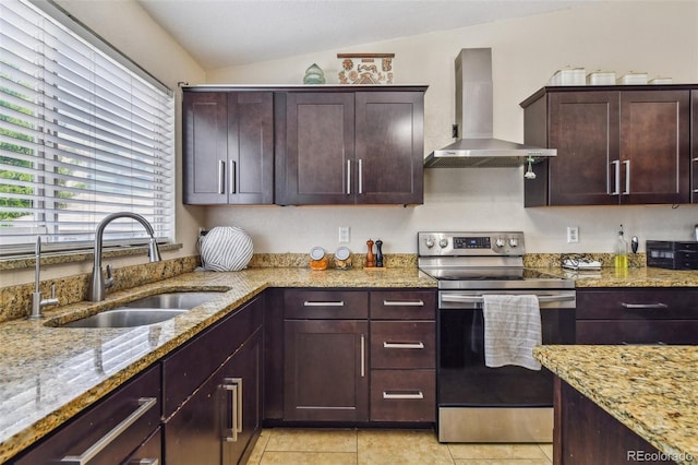20651 E 42nd Ave, Denver, CO 80249 - kitchen with wall chimney exhaust hood, stainless steel electric range oven, lofted ceiling, light stone counters, and light tile patterned floors