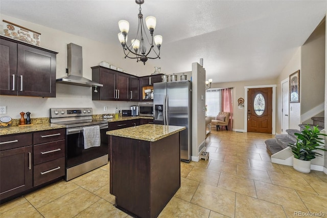 20651 E 42nd Ave, Denver, CO 80249 - kitchen with stainless steel appliances, extractor fan, a chandelier, light stone counters, and a center island