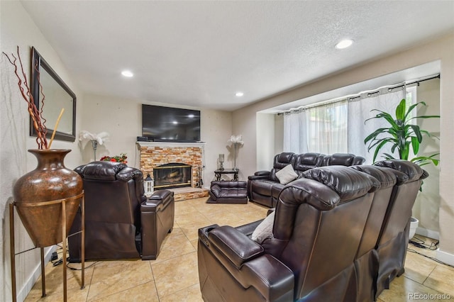 20651 E 42nd Ave, Denver, CO 80249 - living area featuring light tile patterned flooring, recessed lighting, and a stone fireplace