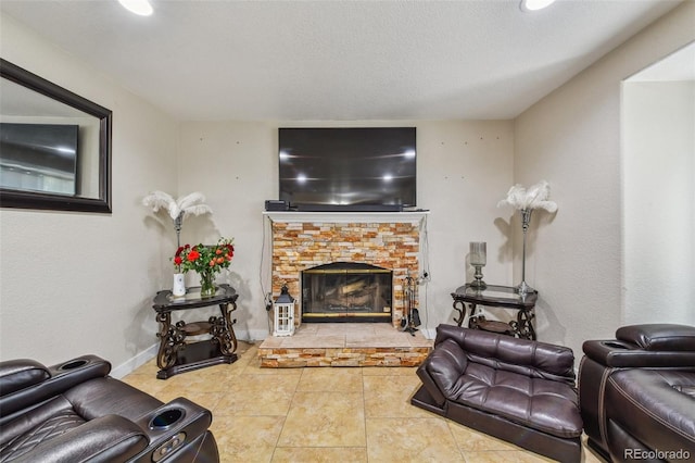 20651 E 42nd Ave, Denver, CO 80249 - tiled living area featuring a fireplace